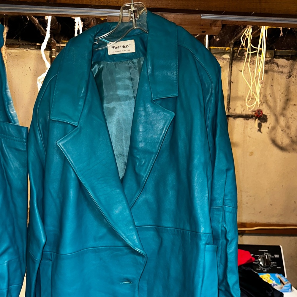 Leather jacket size 10 and skirt size 14 color teal pockets on skirt & jacket